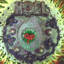 purple wreath cookie with chocolate molded noel